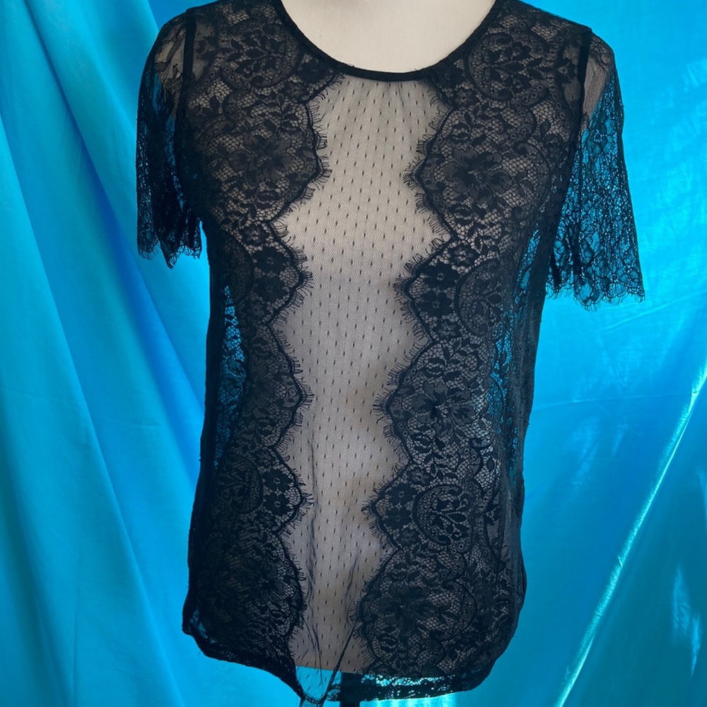 Buy 2items get1 free.3/$20items for$40. Black lace short sleeve top